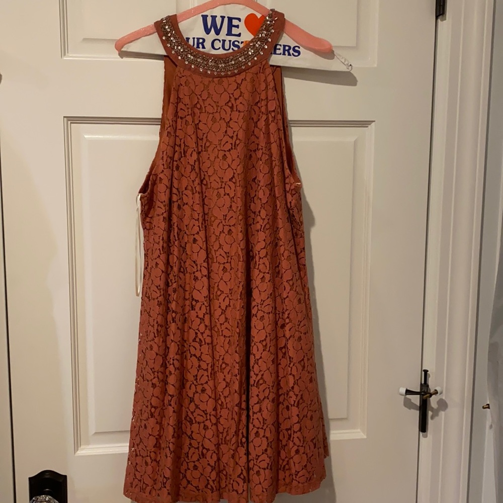 Lace dress with high neck with button back